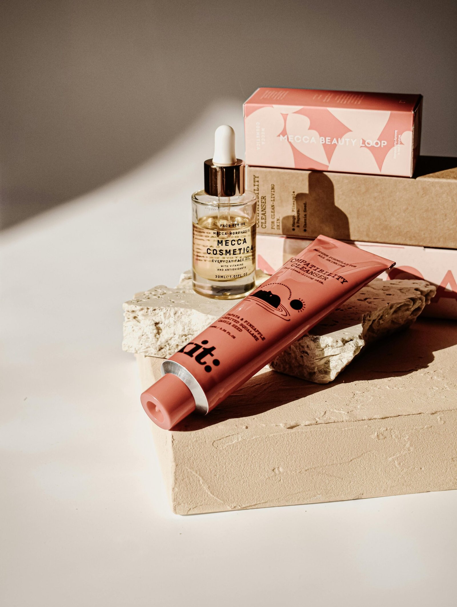 Close-up of skincare products elegantly arranged in warm sunlight showcasing natural beauty and cosmetics.